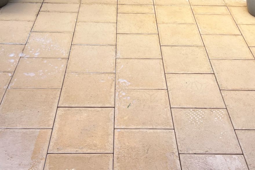 Before and after cleaning on sandstone pavers: after