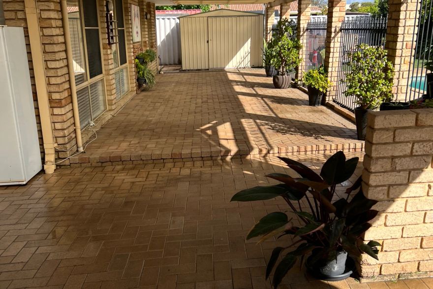 Before and after cleaning on brick pavers · Patio / alfresco: after