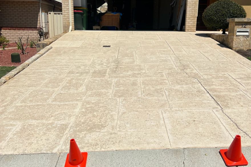 Before and after cleaning on liquid limestone · Driveway: after