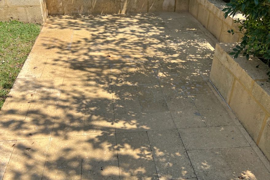 Before and after cleaning on natural stone · Patio / alfresco: after