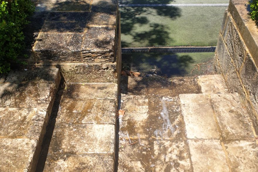 Before and after cleaning on limestone block: before