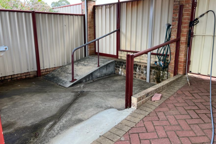 Before and after cleaning on concrete slab: before