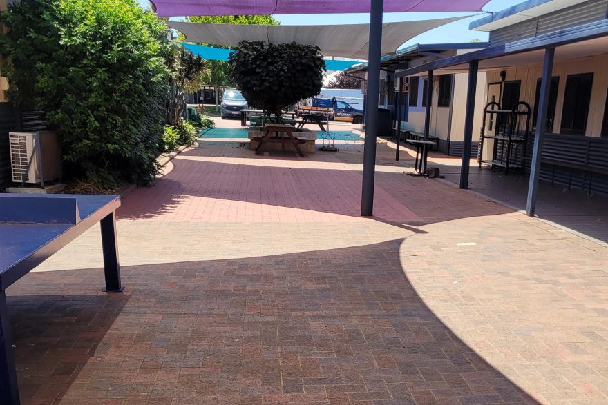 Before and after cleaning on brick pavers: before