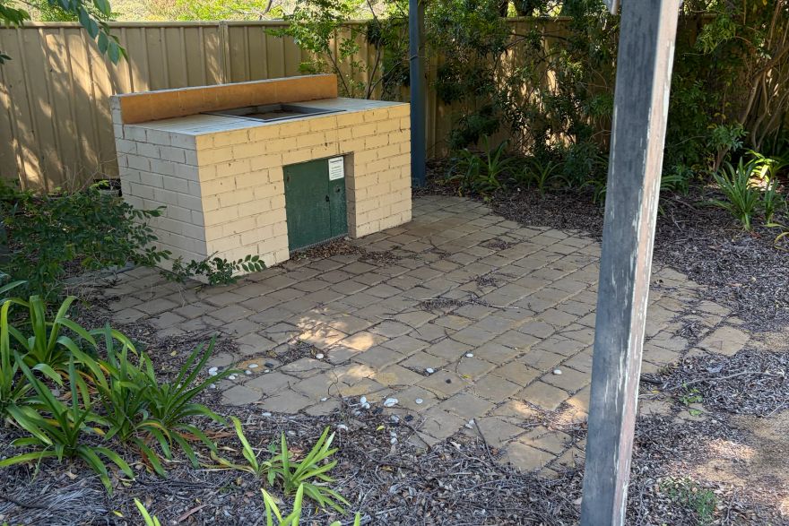 Before and after cleaning on brick pavers: before