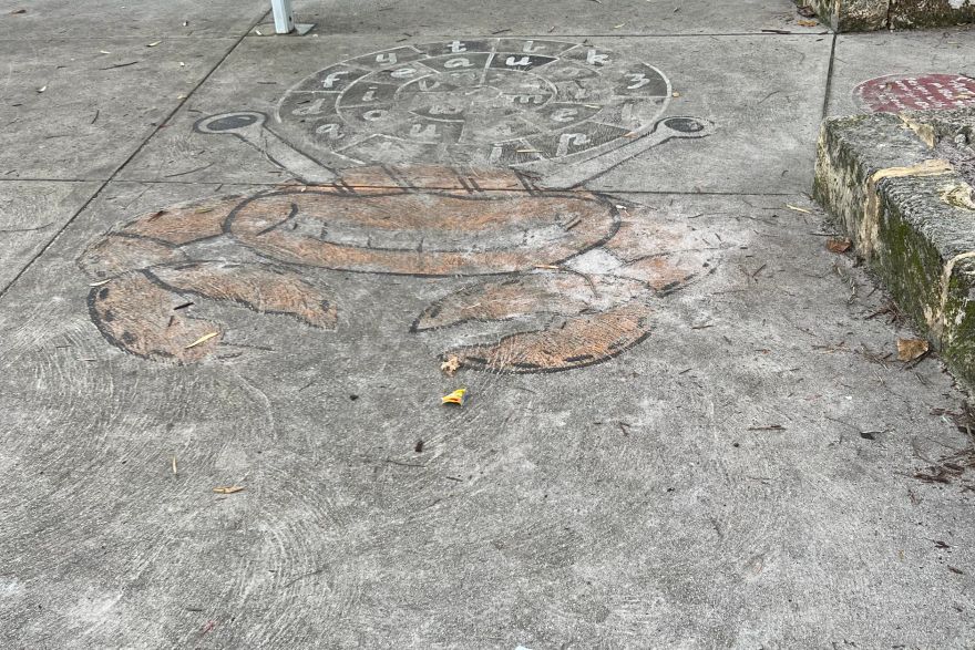 Before and after paint removal on concrete slab: before