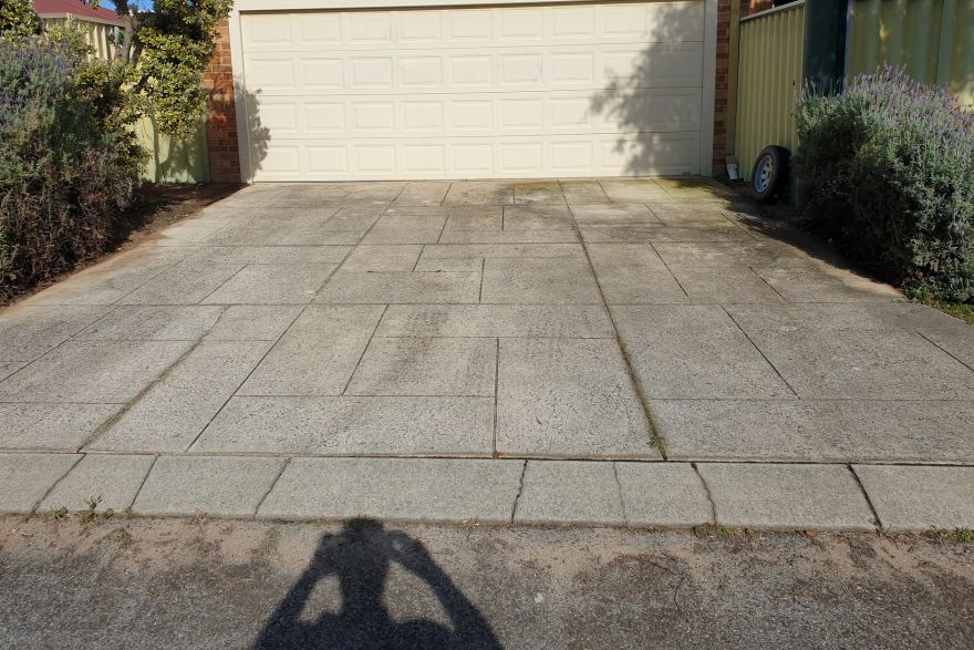 Before and after cleaning on liquid limestone · Driveway: before