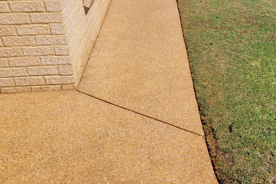 Before and after rust / bore stains on concrete exposed aggregate · Driveway: after