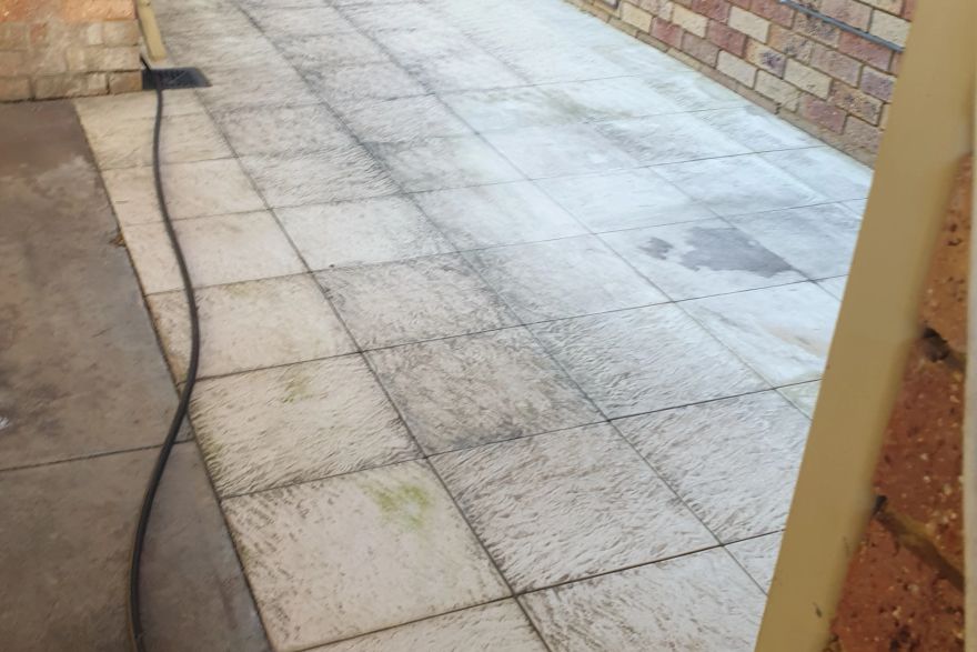 Before and after cleaning on sandstone pavers: before