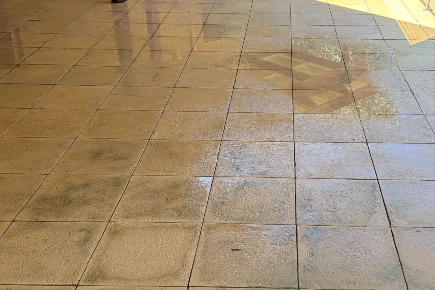 Before and after cleaning on sandstone pavers · Patio / alfresco: after