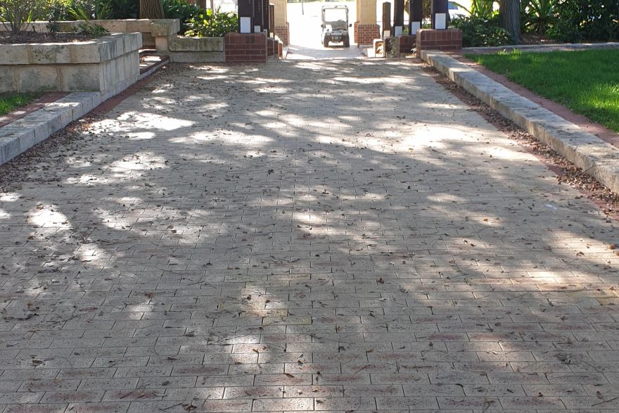 Before and after cleaning on brick pavers: before