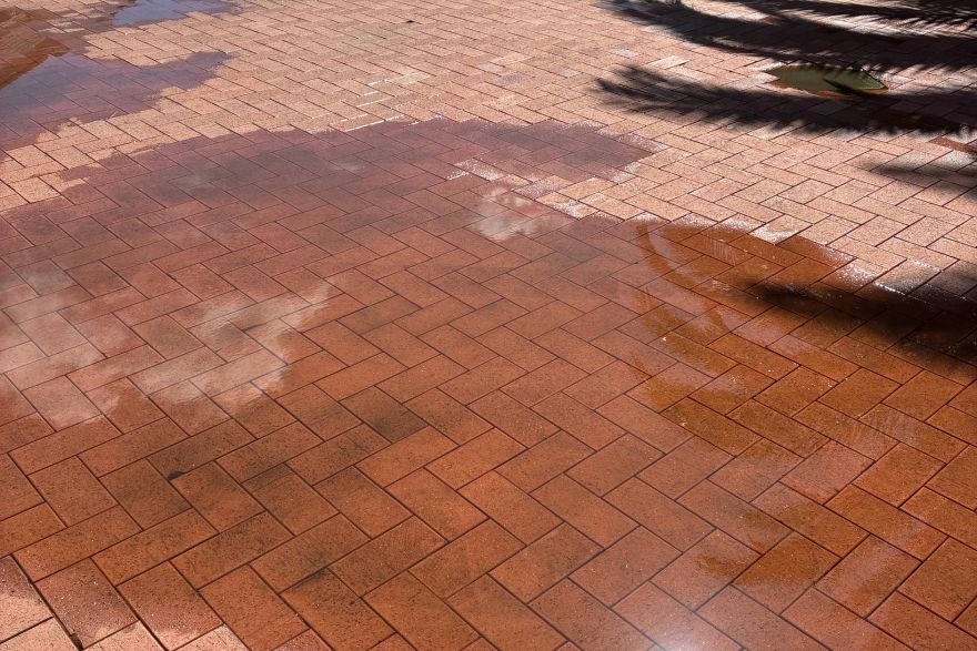 Before and after cleaning on brick pavers · Patio / alfresco: after