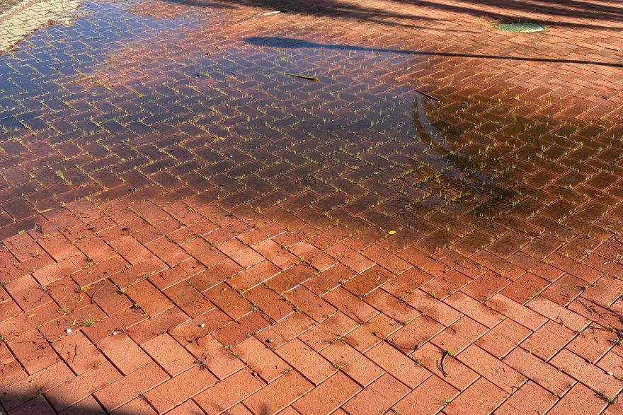 Before and after cleaning on brick pavers · Patio / alfresco: before
