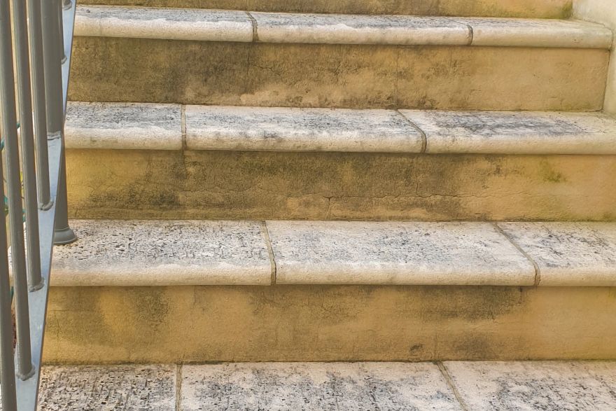 Before and after cleaning on limestone block: before
