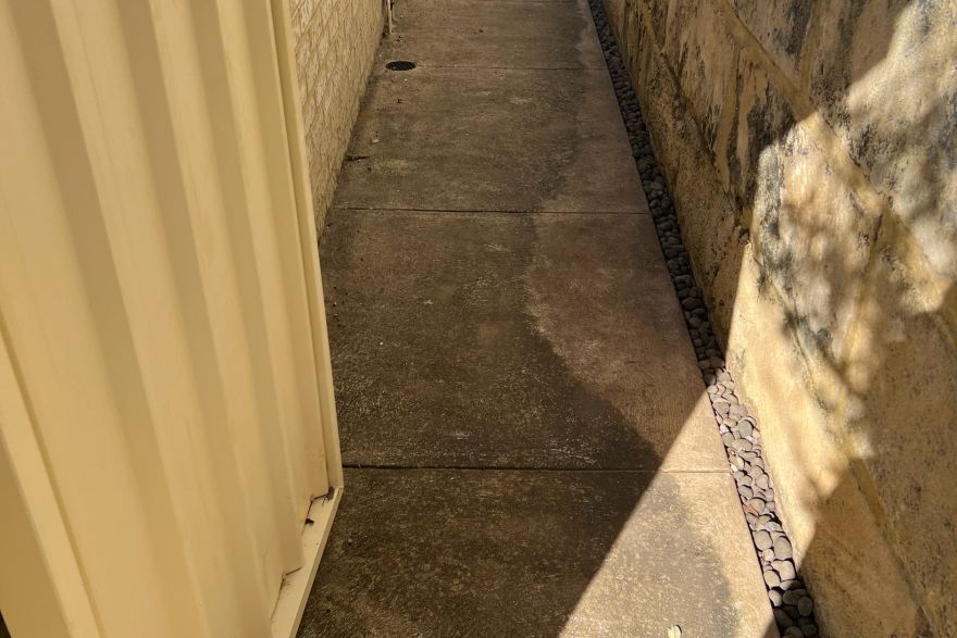 Before and after cleaning on concrete slab: before