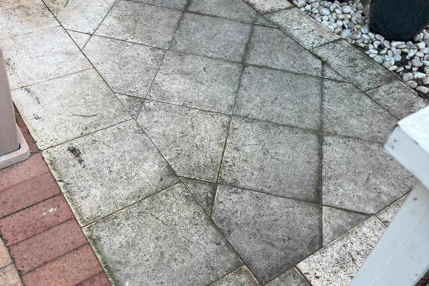 Before and after cleaning on sandstone pavers: before