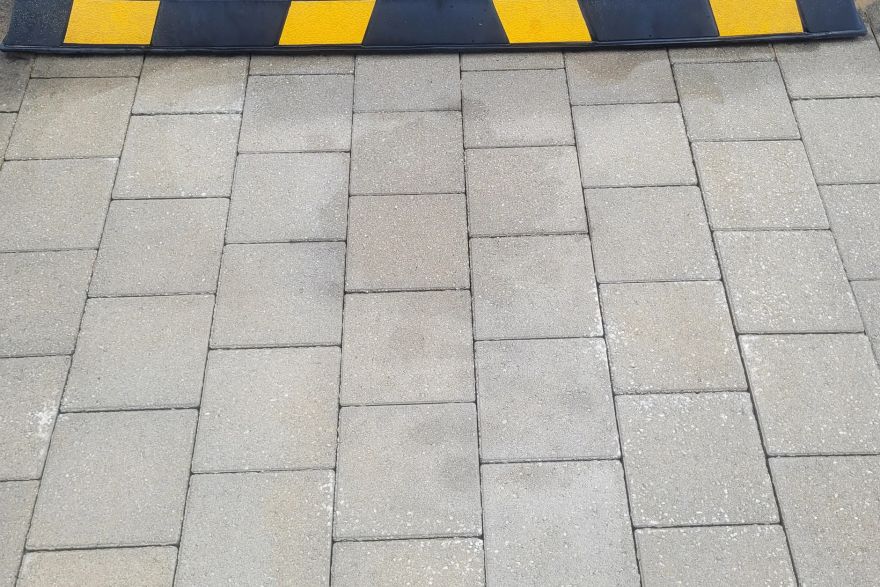 Before and after oil stains on brick pavers: after