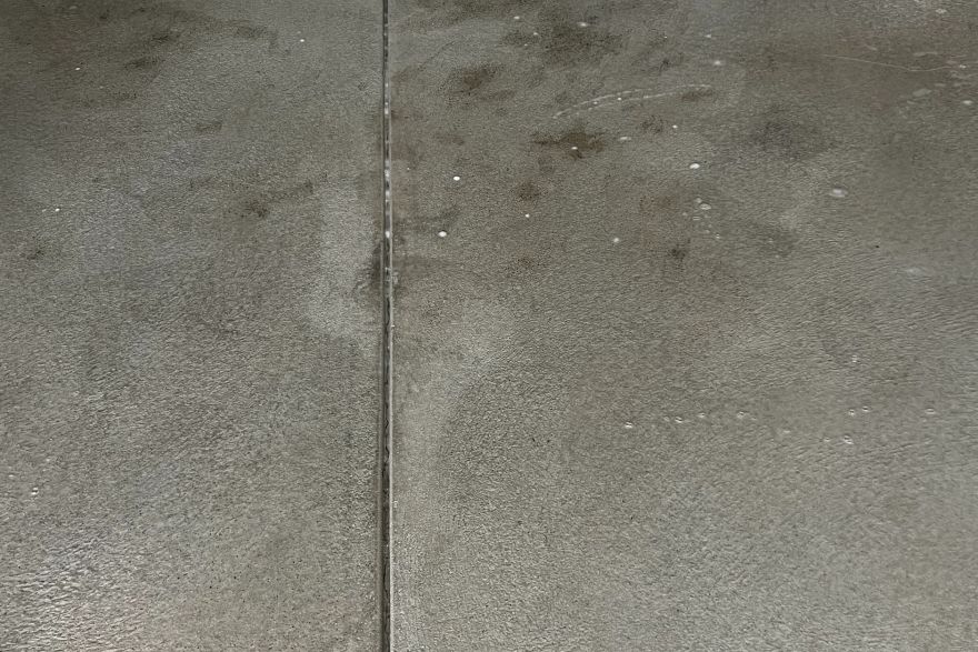 Before and after oil stains on concrete slab · Garage floor: after