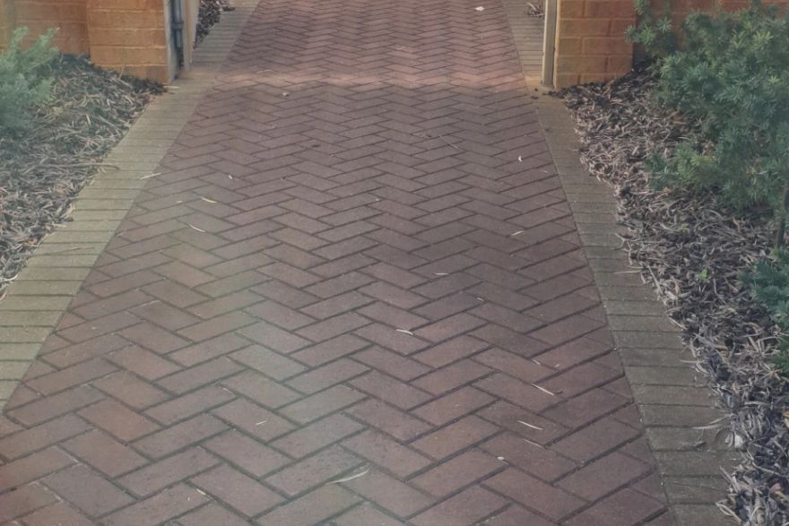 Before and after cleaning on brick pavers · Path: before