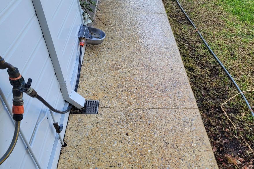 Before and after rust / bore stains on concrete exposed aggregate: after