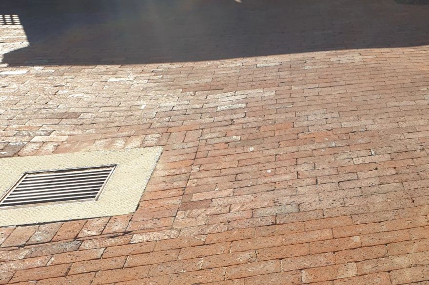 Before and after cleaning on brick pavers: after
