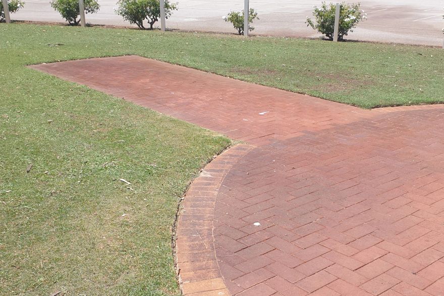 Before and after rust / bore stains on brick pavers: before