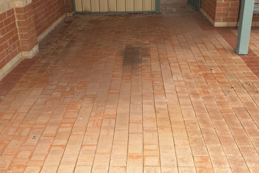 Before and after cleaning on brick pavers · Driveway: before