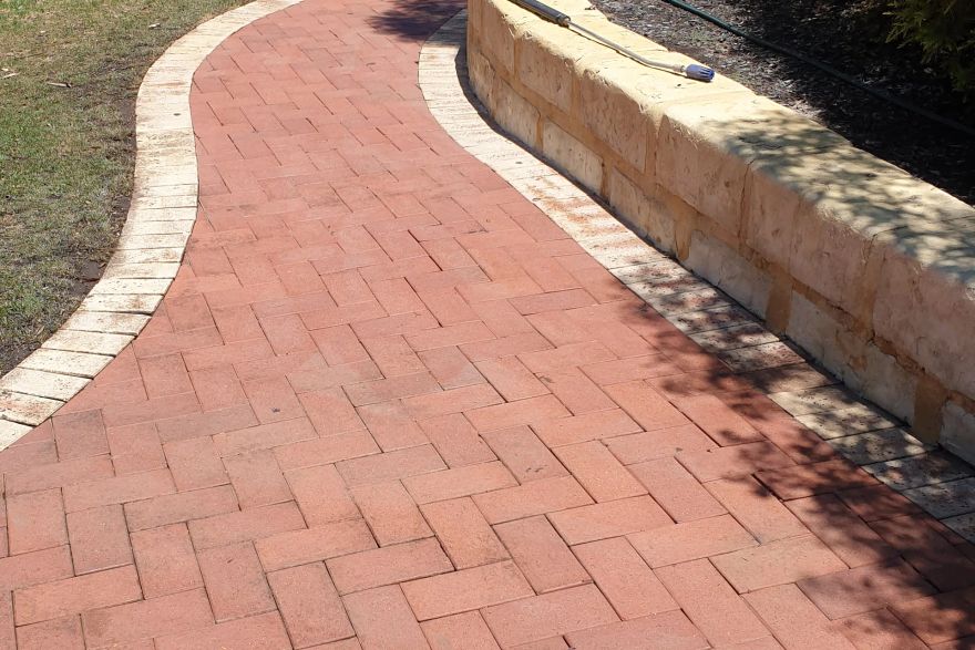 Paving and limestone wall: after