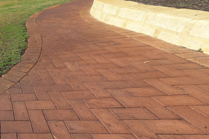 Paving and limestone wall: before