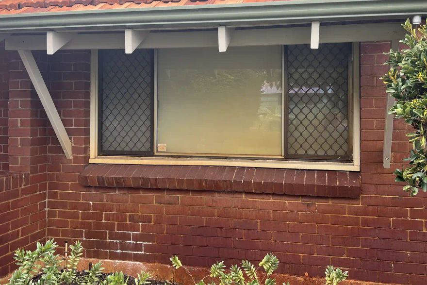 Brick wall and window: before
